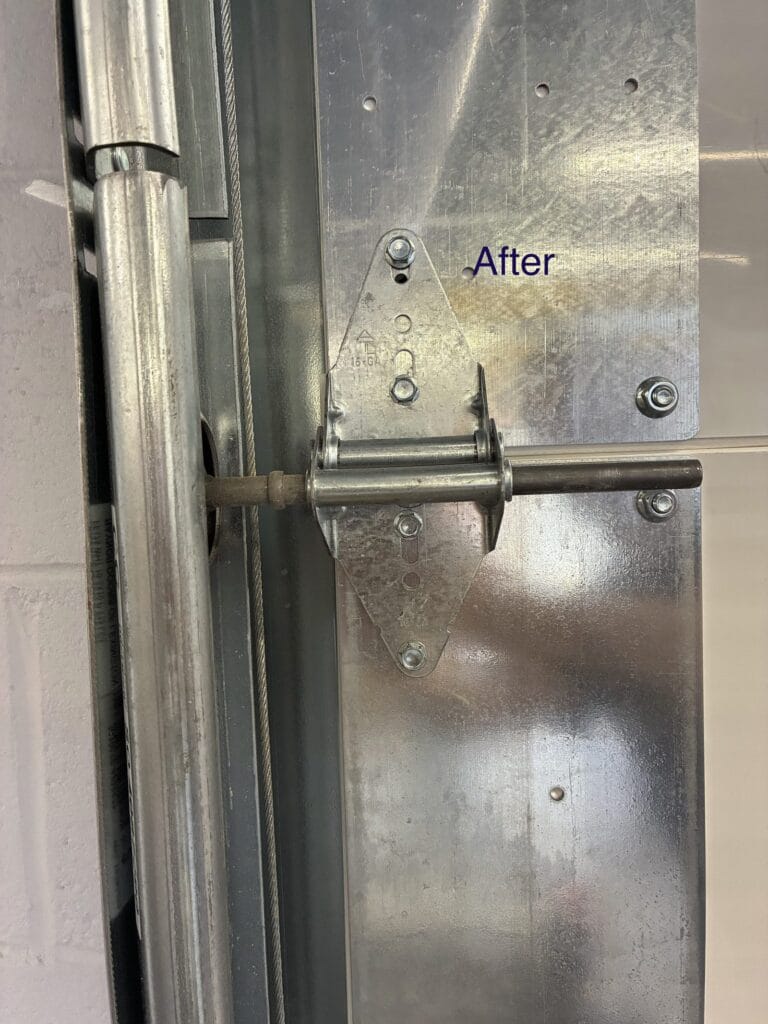 New heavy-gauge commercial door hinge after replacement
