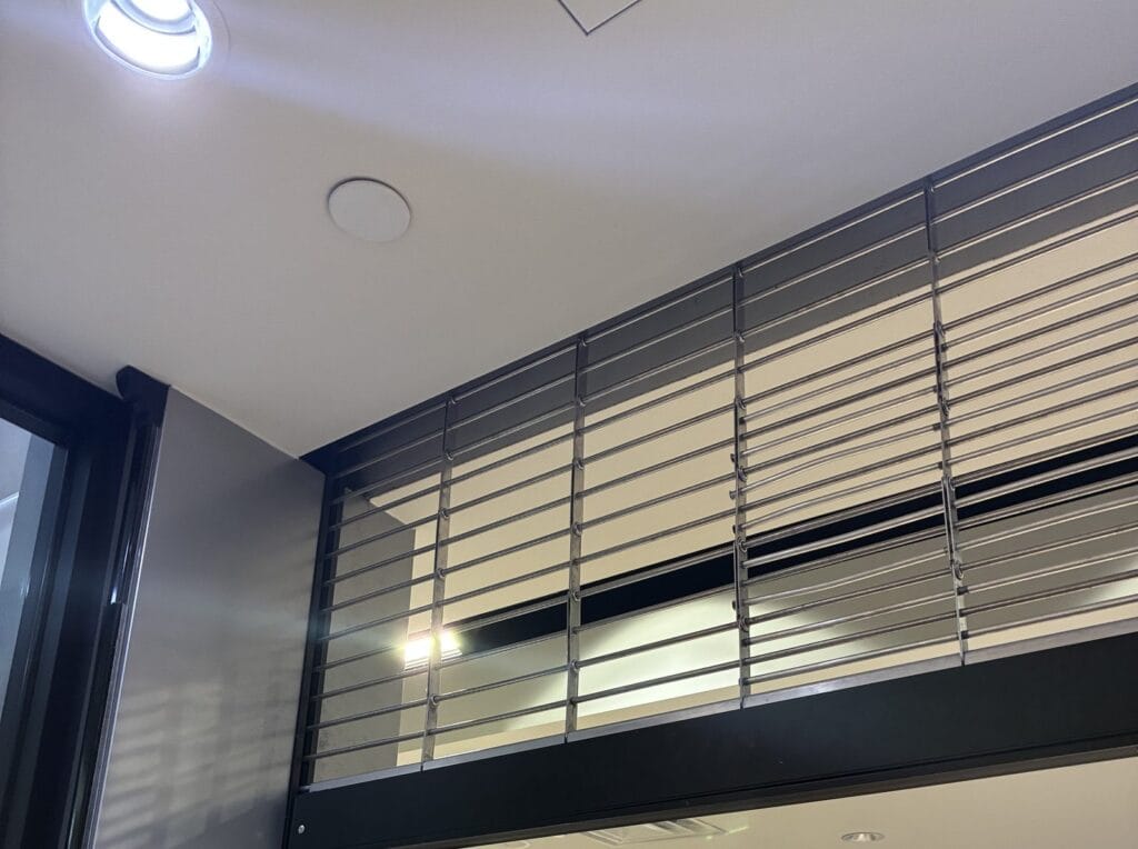 Storefront rolling security grille installed at a retail location
